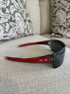 Oakley Performance Wrap Sunglasses in Translucent Gray with Red Temples